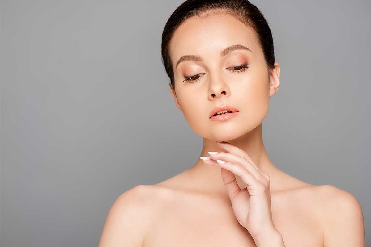 Beautiful woman showing her Perfect Skin
